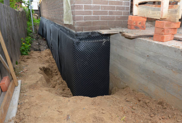 Happy homeowners after waterproofing job in Houghton